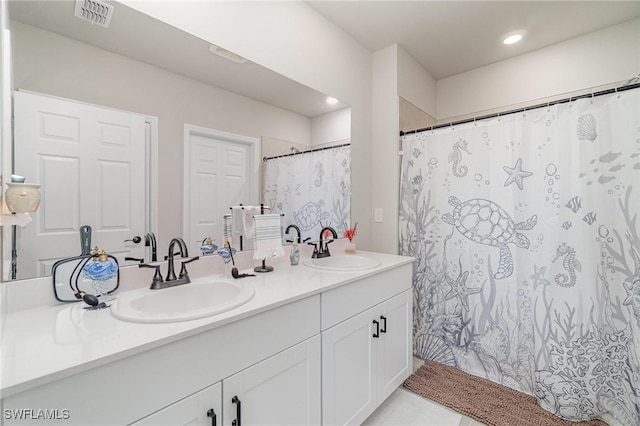 full bathroom featuring a sink, recessed lighting, double vanity, and visible vents