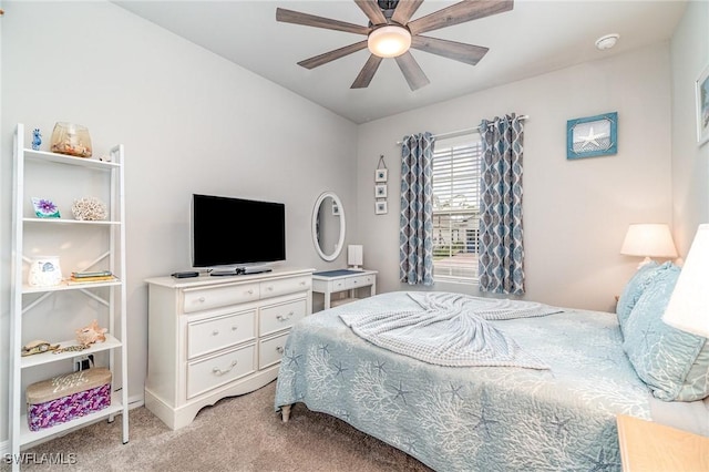 bedroom featuring a ceiling fan and light colored carpet
