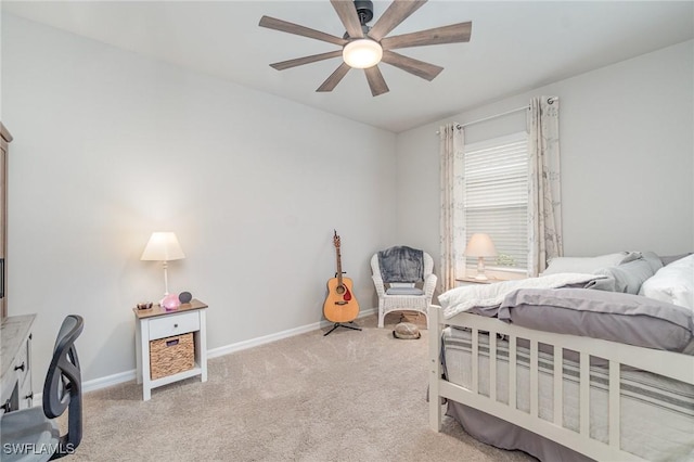 bedroom featuring baseboards, ceiling fan, and light carpet