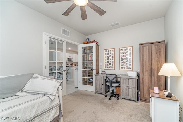 bedroom featuring light colored carpet, a ceiling fan, visible vents, and french doors