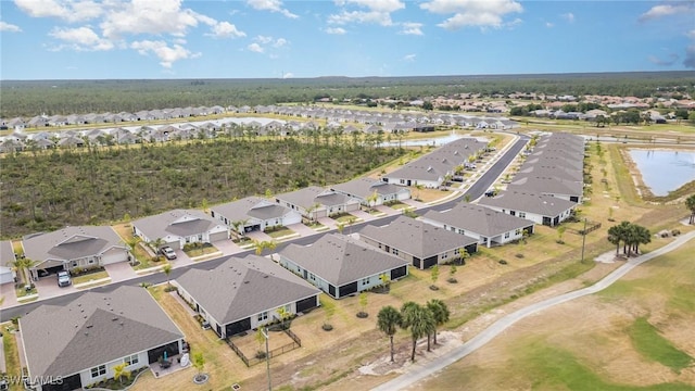 bird's eye view featuring a water view and a residential view