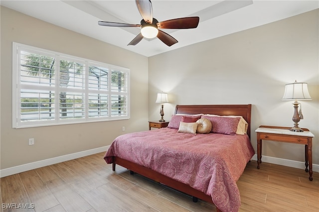 10419 Materita Dr, Fort Myers, FL 33913 - bedroom with wood finished floors and a ceiling fan