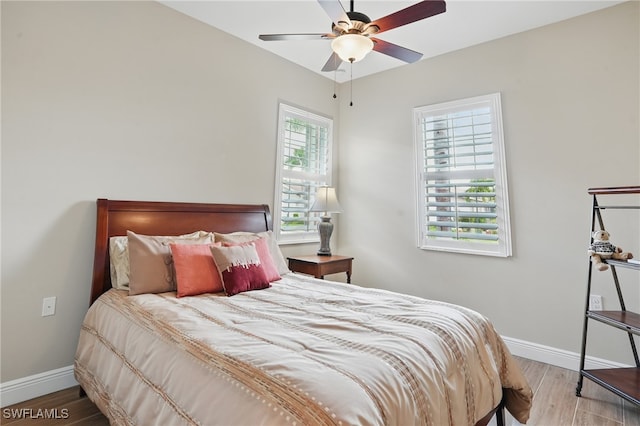 10419 Materita Dr, Fort Myers, FL 33913 - bedroom featuring wood finished floors and ceiling fan