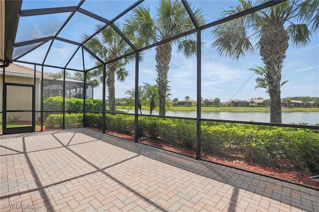 10419 Materita Dr, Fort Myers, FL 33913 - unfurnished sunroom featuring a water view