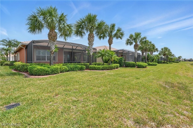 10419 Materita Dr, Fort Myers, FL 33913 - view of grassy yard with a lanai