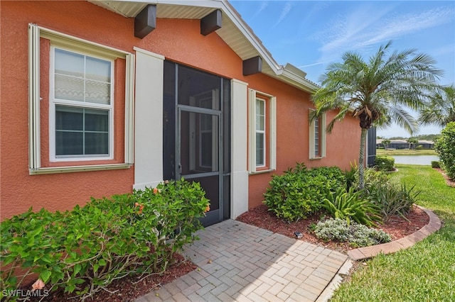 10419 Materita Dr, Fort Myers, FL 33913 - view of home's exterior with stucco siding and a water view