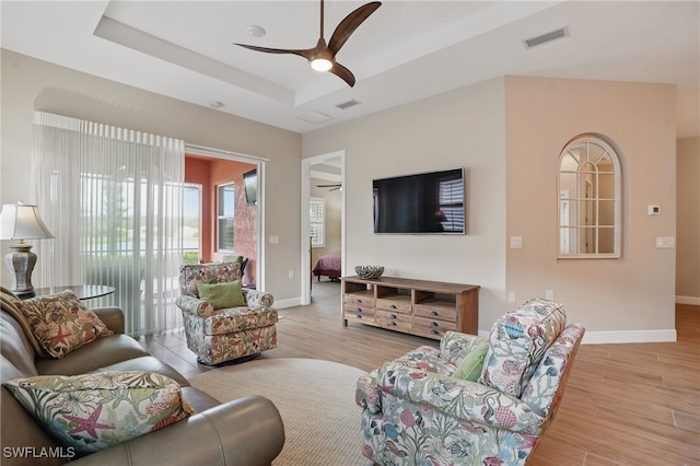 10419 Materita Dr, Fort Myers, FL 33913 - living room with ceiling fan, wood finished floors, and a raised ceiling