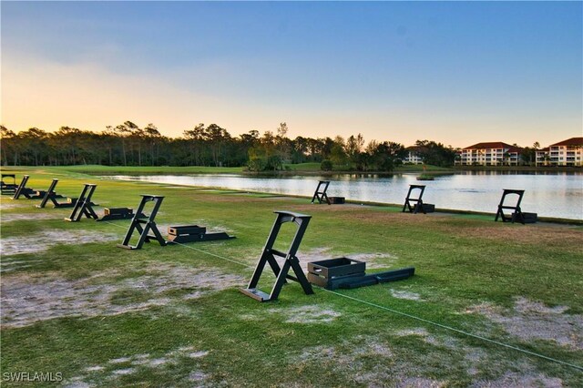 10419 Materita Dr, Fort Myers, FL 33913 - view of community with a water view and a yard