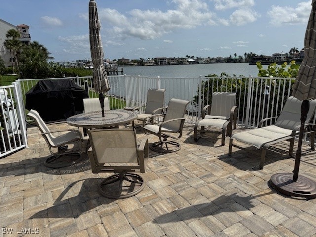 9380 Gulf Shore Dr Unit 101, Naples, FL 34108 - view of patio / terrace with a water view
