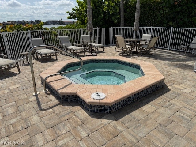 9380 Gulf Shore Dr Unit 101, Naples, FL 34108 - view of pool featuring a patio and a community hot tub