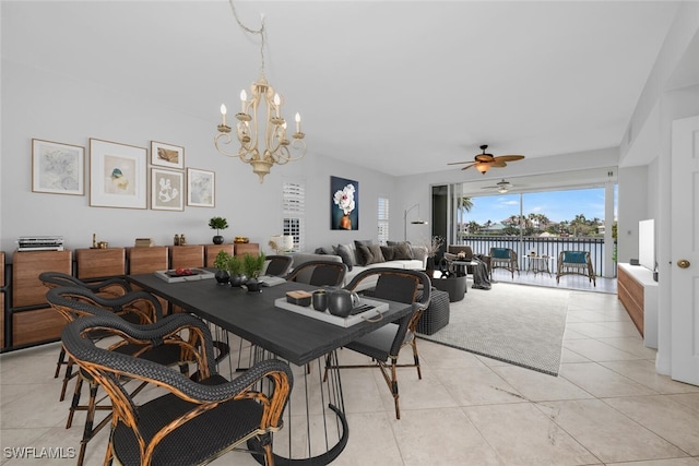 9380 Gulf Shore Dr Unit 101, Naples, FL 34108 - dining room with light tile patterned floors, a water view, a ceiling fan, and a chandelier