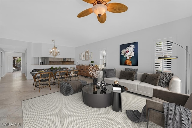 9380 Gulf Shore Dr Unit 101, Naples, FL 34108 - living room featuring a chandelier, a ceiling fan, and light tile patterned floors