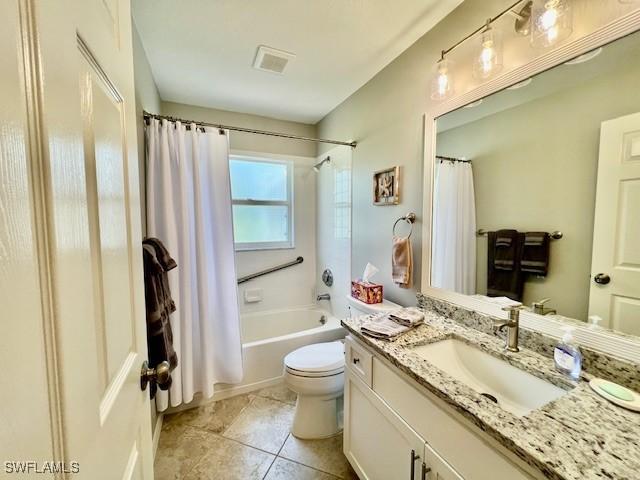 1106 Islamorada Blvd, Punta Gorda, FL 33955 - bathroom featuring vanity, shower / bath combination with curtain, and tile patterned floors