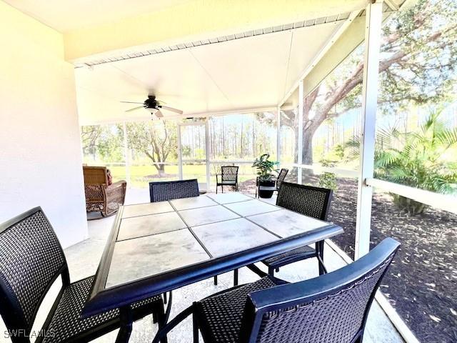 1106 Islamorada Blvd, Punta Gorda, FL 33955 - sunroom featuring ceiling fan and outdoor dining space