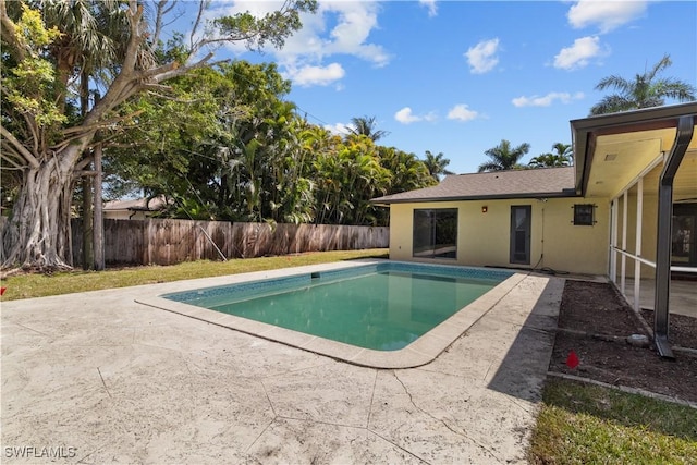 view of pool featuring a fenced backyard, a fenced in pool, and a patio area