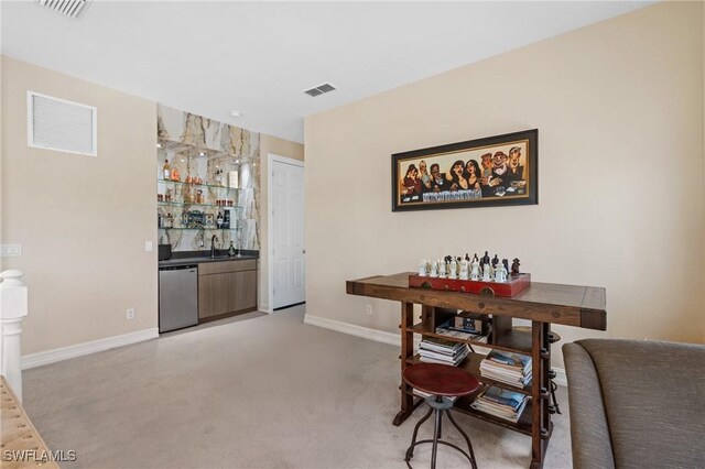 636 102nd Ave N, Naples, FL 34108 - dining space with wet bar and baseboards