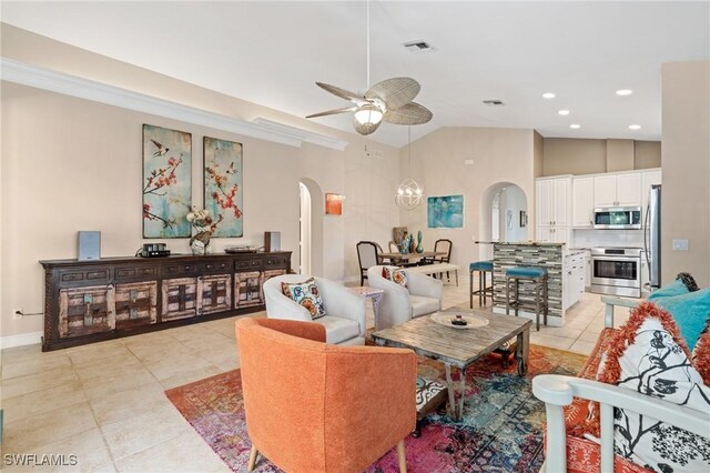 636 102nd Ave N, Naples, FL 34108 - living room with arched walkways, ceiling fan, light tile patterned floors, recessed lighting, and high vaulted ceiling