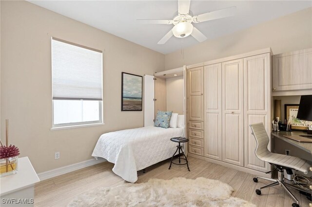636 102nd Ave N, Naples, FL 34108 - bedroom with an office area, light wood-type flooring, a ceiling fan, and baseboards