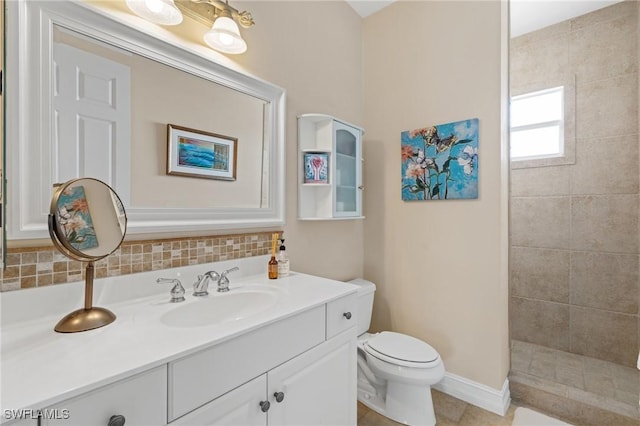 636 102nd Ave N, Naples, FL 34108 - bathroom featuring toilet, vanity, tiled shower, backsplash, and baseboards