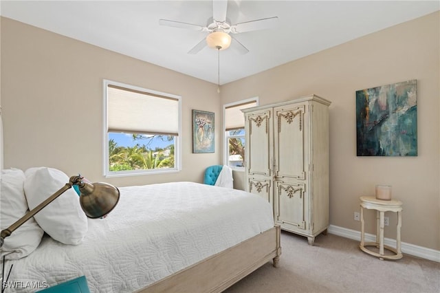636 102nd Ave N, Naples, FL 34108 - bedroom featuring light carpet, baseboards, and a ceiling fan