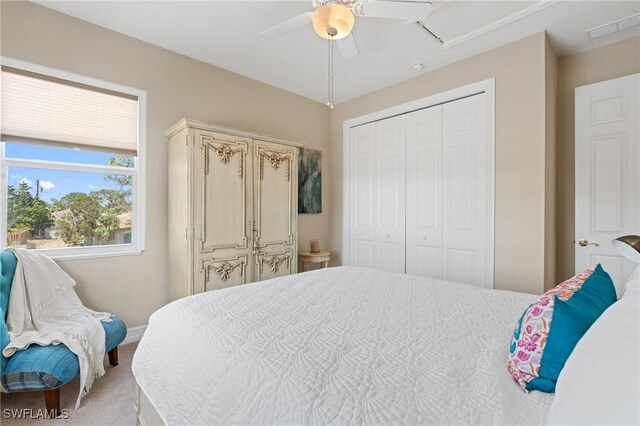 636 102nd Ave N, Naples, FL 34108 - bedroom with a closet, light carpet, ceiling fan, and baseboards