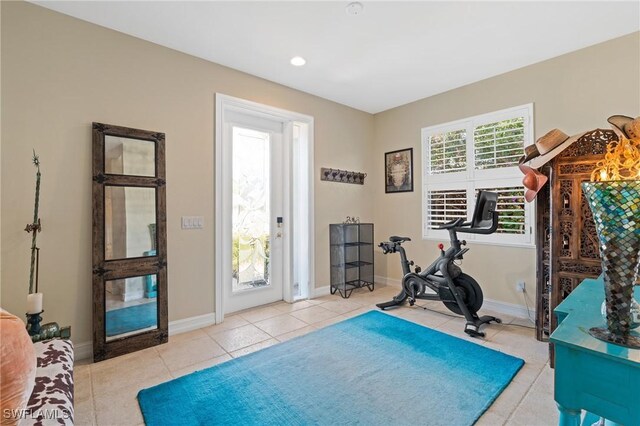 636 102nd Ave N, Naples, FL 34108 - workout room featuring tile patterned flooring and baseboards