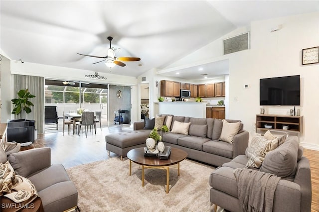 4312 NW 36th Ave, Cape Coral, FL 33993 - living area with light wood-style floors, ceiling fan, lofted ceiling, and visible vents
