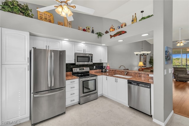 162 Newport Dr Unit 1208, Naples, FL 34114 - kitchen featuring a sink, high vaulted ceiling, ceiling fan with notable chandelier, stainless steel appliances, and decorative backsplash
