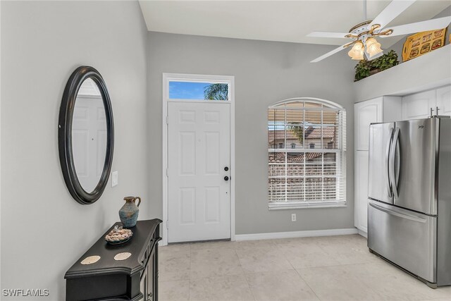 162 Newport Dr Unit 1208, Naples, FL 34114 - foyer featuring light tile patterned floors, ceiling fan, and baseboards