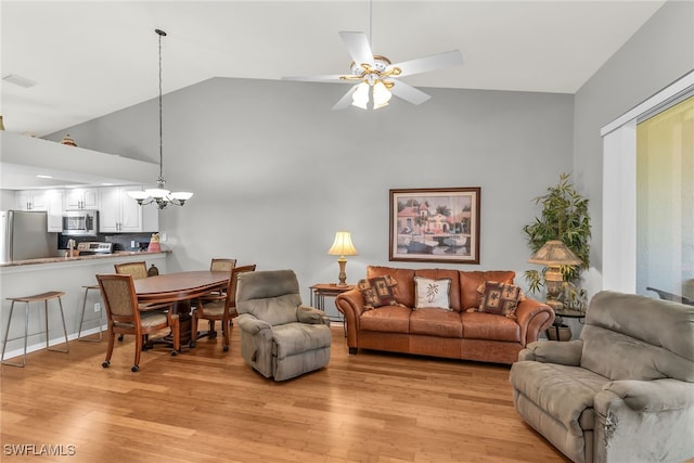 162 Newport Dr Unit 1208, Naples, FL 34114 - living area with high vaulted ceiling, ceiling fan with notable chandelier, light wood-type flooring, and visible vents