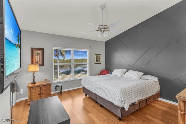 162 Newport Dr Unit 1208, Naples, FL 34114 - bedroom featuring baseboards, ceiling fan, and wood finished floors