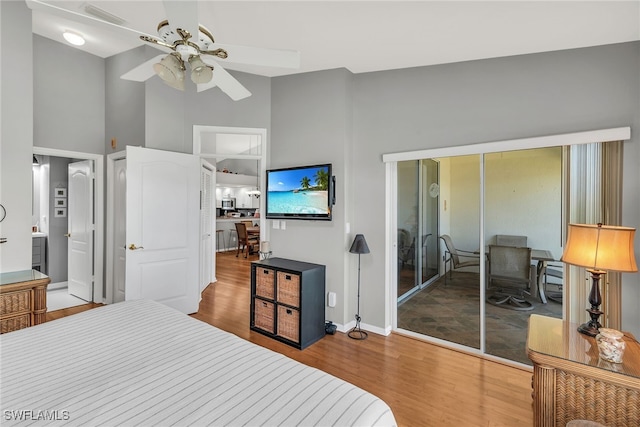 162 Newport Dr Unit 1208, Naples, FL 34114 - bedroom featuring a high ceiling, baseboards, wood finished floors, visible vents, and a closet