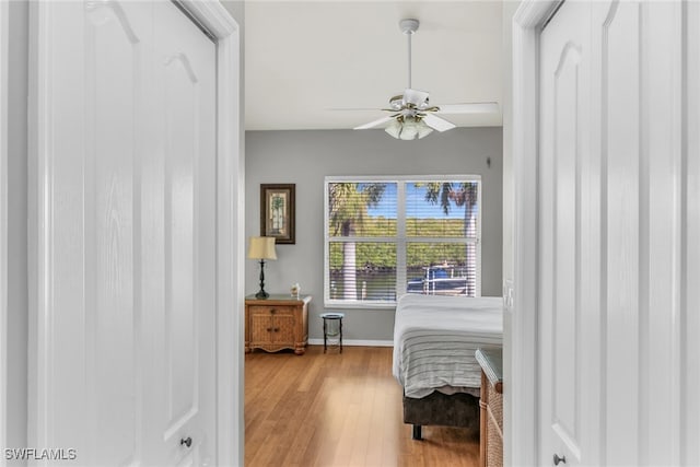 162 Newport Dr Unit 1208, Naples, FL 34114 - bedroom with baseboards, ceiling fan, and wood finished floors