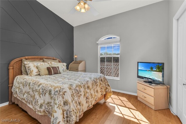 162 Newport Dr Unit 1208, Naples, FL 34114 - bedroom featuring baseboards, a ceiling fan, and light wood-style flooring
