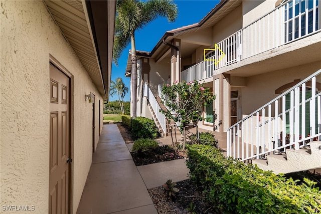 162 Newport Dr Unit 1208, Naples, FL 34114 - exterior space with stairs and stucco siding