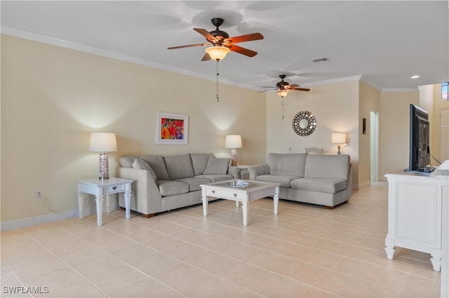 living area with light tile patterned floors, ceiling fan, ornamental molding, and baseboards