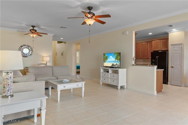living area with ceiling fan, visible vents, ornamental molding, and light tile patterned floors