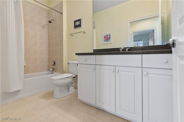 bathroom with vanity, shower / tub combo with curtain, tile patterned floors, and toilet