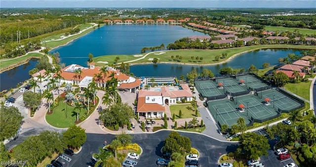 aerial view featuring a water view, a residential view, and golf course view