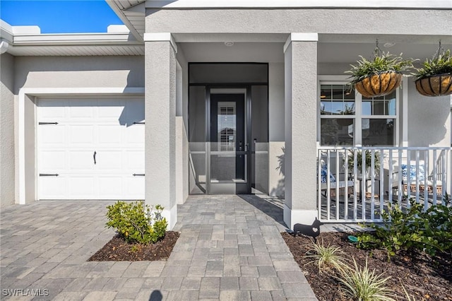 property entrance featuring stucco siding