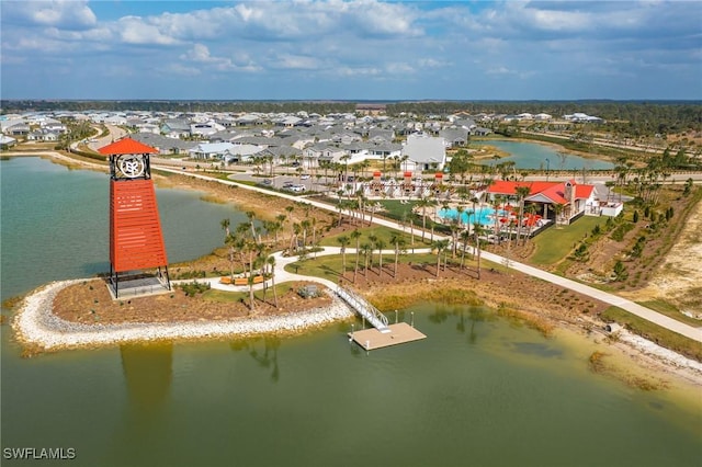 bird's eye view with a water view and a residential view