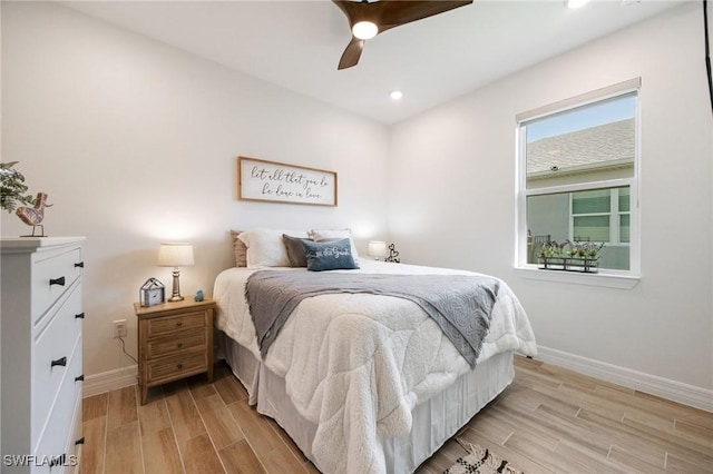 bedroom featuring recessed lighting, wood finish floors, ceiling fan, and baseboards