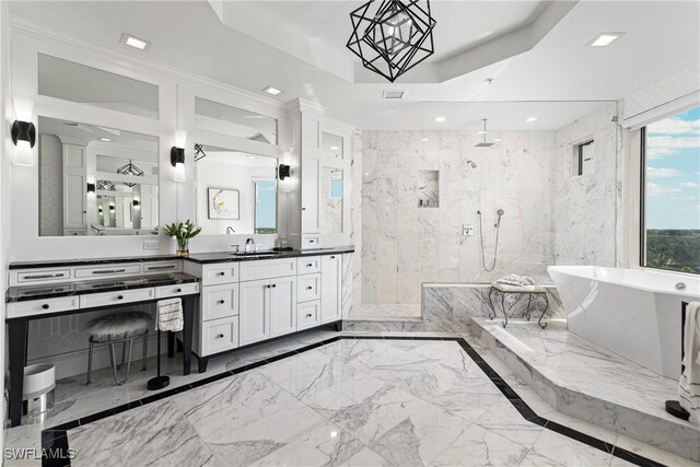 4931 Bonita Bay Blvd Unit 601, Bonita Springs, FL 34134 - bathroom with marble finish floor, a freestanding tub, a marble finish shower, and a raised ceiling