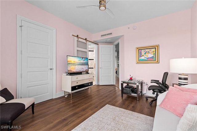4931 Bonita Bay Blvd Unit 601, Bonita Springs, FL 34134 - home office featuring visible vents, wood finished floors, baseboards, ceiling fan, and a barn door