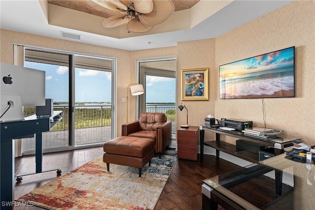 4931 Bonita Bay Blvd Unit 601, Bonita Springs, FL 34134 - sitting room with visible vents, a raised ceiling, dark wood-style flooring, and ceiling fan