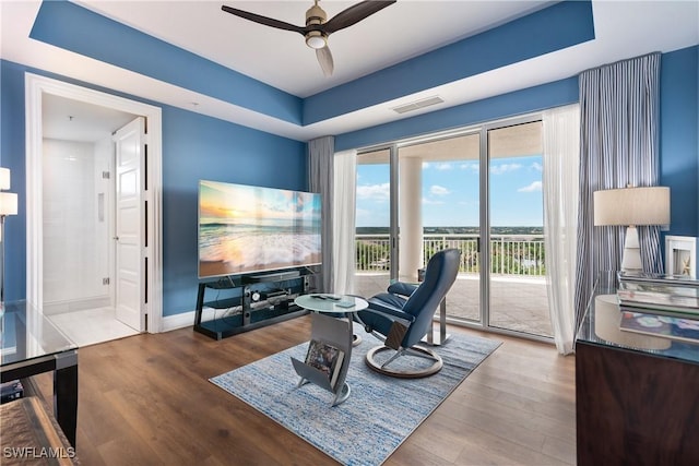 4931 Bonita Bay Blvd Unit 601, Bonita Springs, FL 34134 - sitting room with visible vents, a ceiling fan, baseboards, and wood finished floors