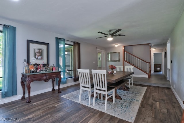3690 27th Ave SW, Naples, FL 34117 - dining area featuring baseboards, a ceiling fan, dark wood-style flooring, and stairway