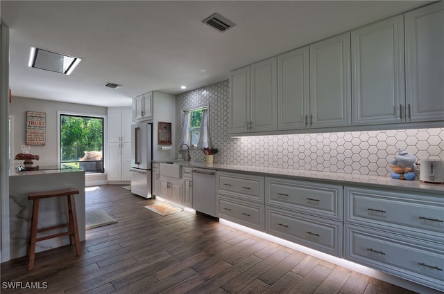 3690 27th Ave SW, Naples, FL 34117 - kitchen with visible vents, a sink, tasteful backsplash, high end refrigerator, and dishwasher