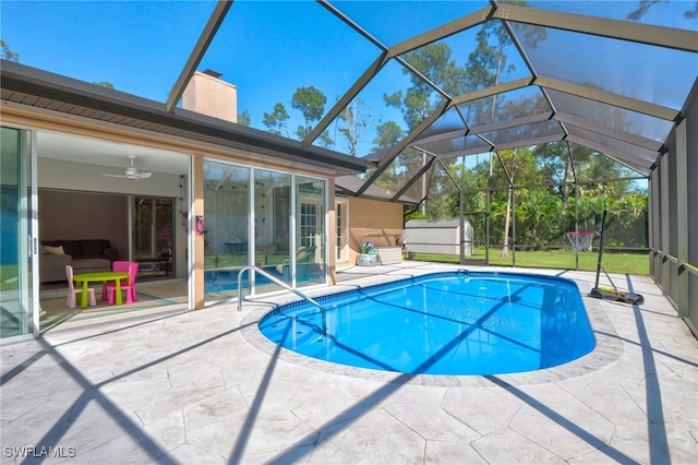 3690 27th Ave SW, Naples, FL 34117 - outdoor pool with a patio, an outdoor structure, a shed, and glass enclosure