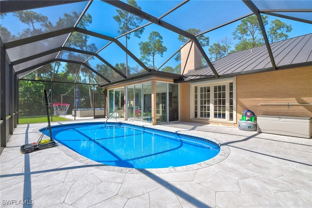 3690 27th Ave SW, Naples, FL 34117 - outdoor pool with glass enclosure, a patio, and french doors